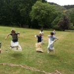 The sack race is down to the rope, almost